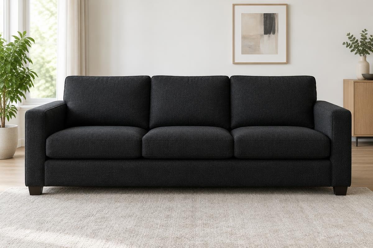 Illustration d'un canapé en textile noir à trois places, propre après entretien